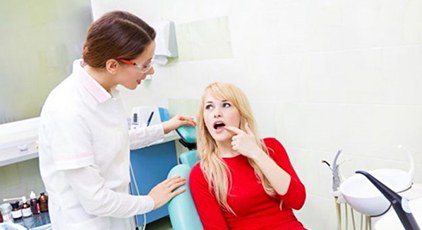 a patient visiting her dentist for a root canal