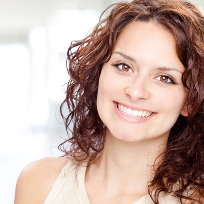 Woman smiling after dental bonding