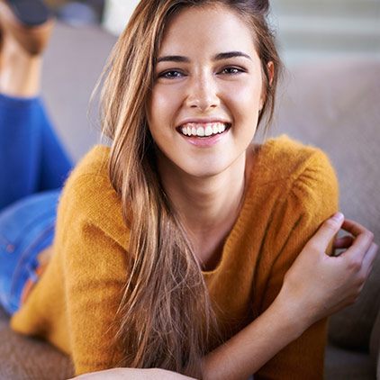 Woman smiling after cosmetic dentistry