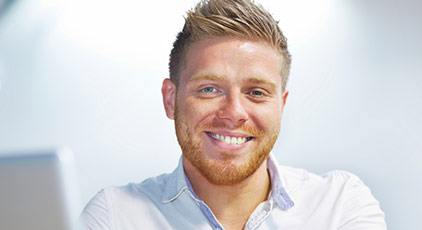 Man smiling after dental bonding