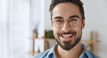 Young man with dental implants in Kernersville