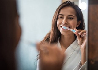 a patient brushing their teeth