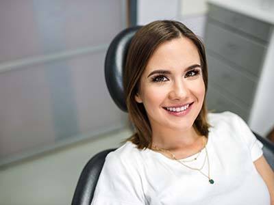 Happy dental patient visiting her dentist in Kernersville