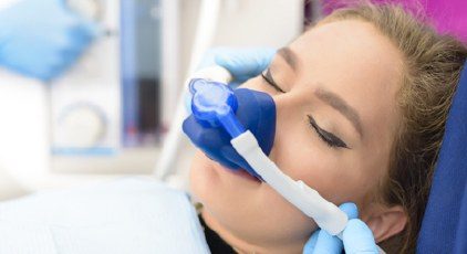 Woman receiving nitrous oxide dental relaxation