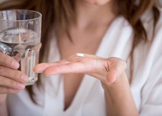 Lady prepares to take pill