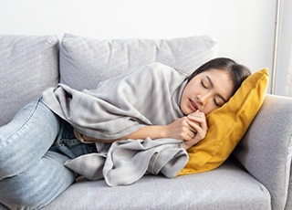 Lady rests after receiving dental treatment