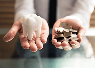 a fake tooth in a hand