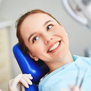 Woman smiling during preventive dentistry visit