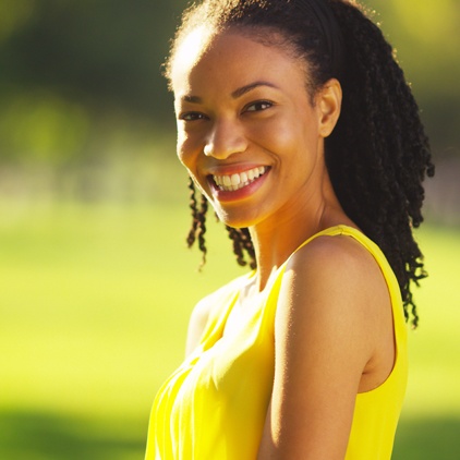 Woman smiling after teeth whitening