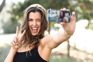 portrait of woman taking selfie