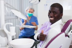 man smiling dental chair