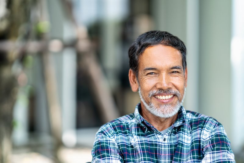 Man smiling with dental implants in Kernersville