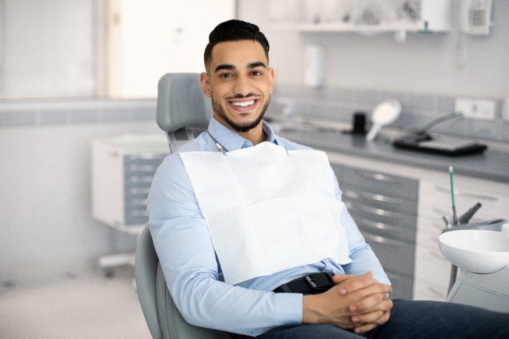 Closeup of man smiling in dentist's treatment chair