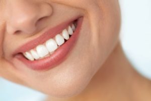 a woman with a bright beautiful smile from cosmetic dental treatments