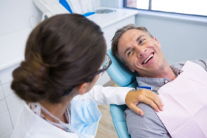 a patient smiling during his dental visit